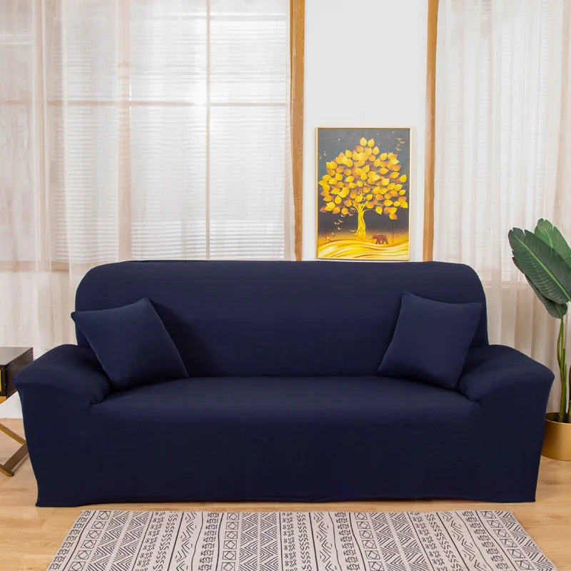 A navy blue elegant faux silk sofa cover displayed on a light wood floor.