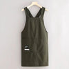 A dark olive green water-resistant kitchen apron with adjustable straps hanging on a wooden hanger.