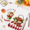A set of two white kitchen towels featuring a strawberry design on one and a red checkered pattern on the other.
