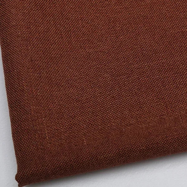 A close-up of a dark brown coarse linen and cotton fabric textile.