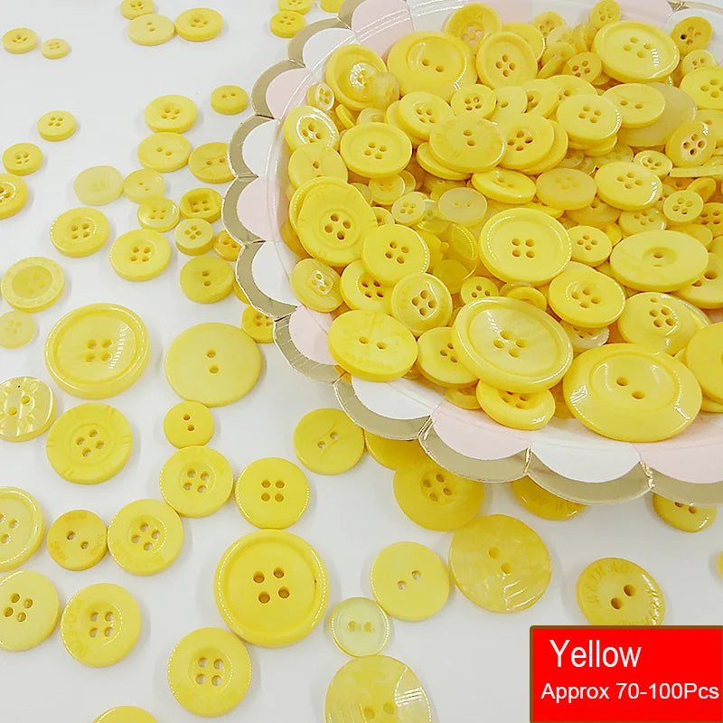 A pile of assorted yellow resin sewing buttons for crafting and DIY projects.