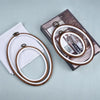 Round wooden embroidery hoops with leather cord and a decorative box for cross stitch