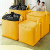 Several bright yellow heavy-duty waterproof storage bags of various sizes are displayed on a wooden floor.