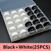 A plastic box containing 25 black and white sewing thread bobbins arranged in a grid.