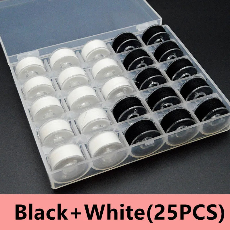 A plastic box containing 25 black and white sewing thread bobbins arranged in a grid.