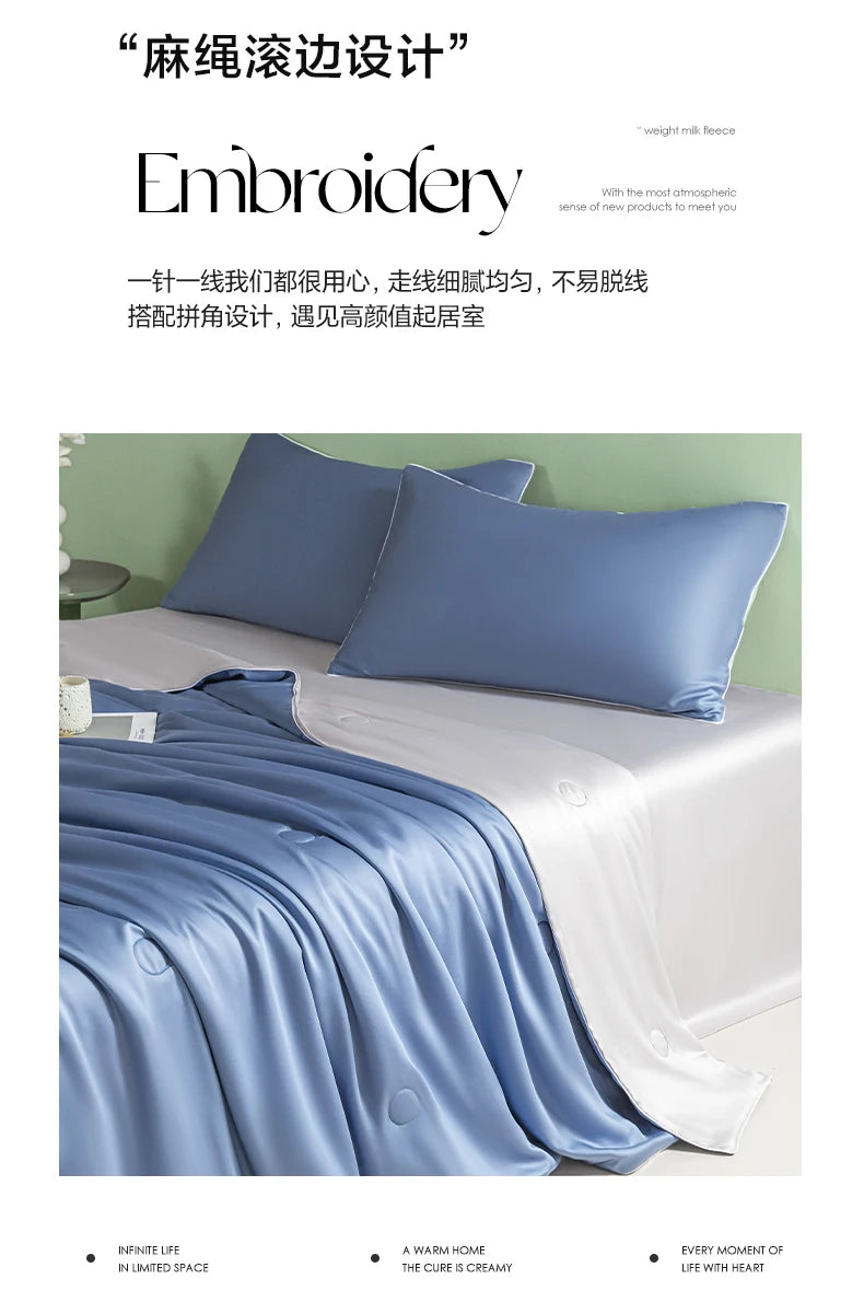 A light blue ice silk quilt draped over a bed, showcasing smooth fabric texture and soft folds.