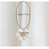A close-up of a beige crocheted floral curtain tieback with a 45cm length and a 7cm flower detail.