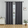 A set of solid gray blackout window curtains hanging on a rod in a bright room.