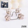 Silver and gold floral button clips used for adjusting jeans waist tightness.