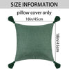 A square olive green linen throw pillow cover with tasseled edges.