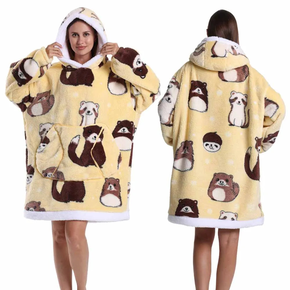 A woman models an oversized patchwork fleece hoodie featuring brown and white bear patterns.