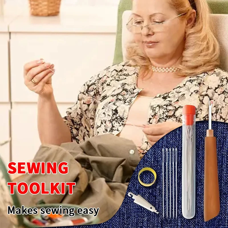 A sewing toolkit showing various tools including a needle and thread on a blue fabric.