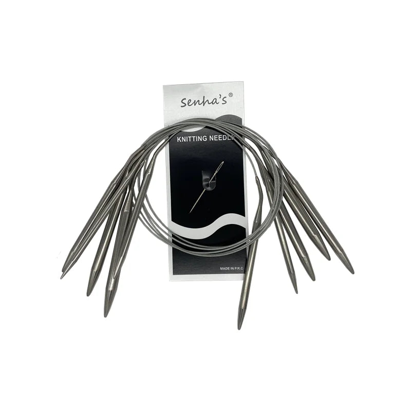 A set of stainless steel circular knitting needles with a black and white label.