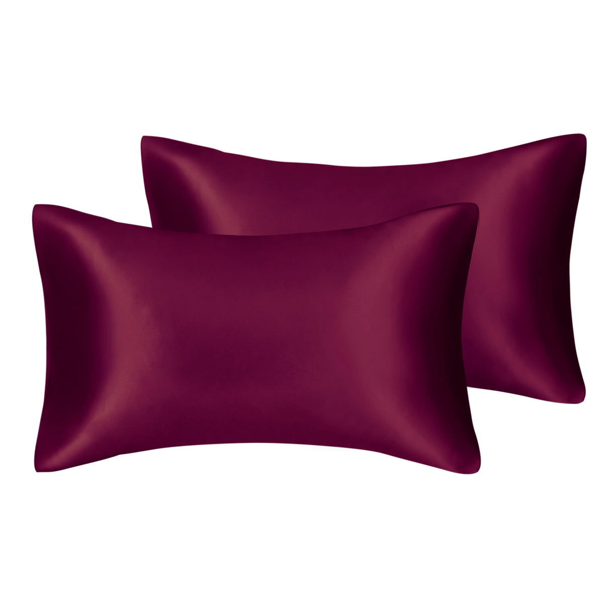 Two deep plum colored silky satin pillow covers, one folded over the other.
