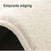 Close-up of a white, fluffy decorative cat mat showing exquisite edging.