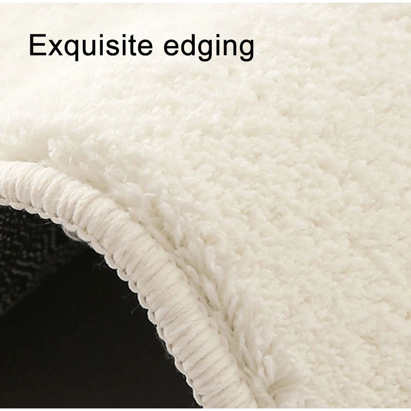 Close-up of a white, fluffy decorative cat mat showing exquisite edging.