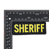 Black embroidered patch with the word SHERIFF in yellow thread against a ruler scale.