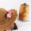A golden brown crochet ice rope is shown next to a spool of the same material.