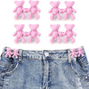 Set of pink bear button pins attached to a denim jean fabric