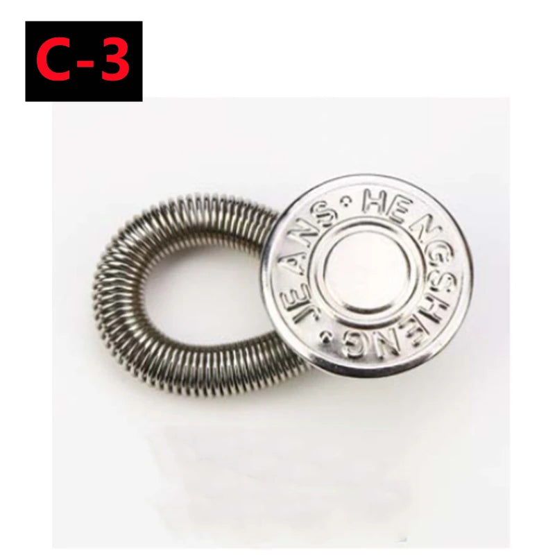 A silver metal button extender shaped like a spring, used for pants and jeans.