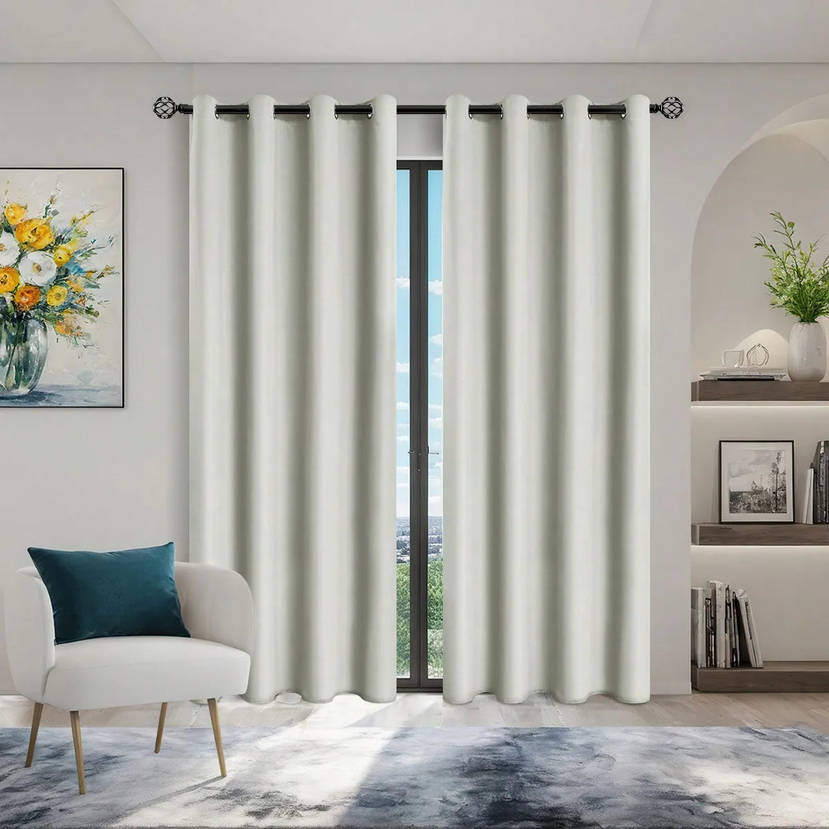Light beige blackout privacy curtains hanging in a doorway with a white armchair and artwork.