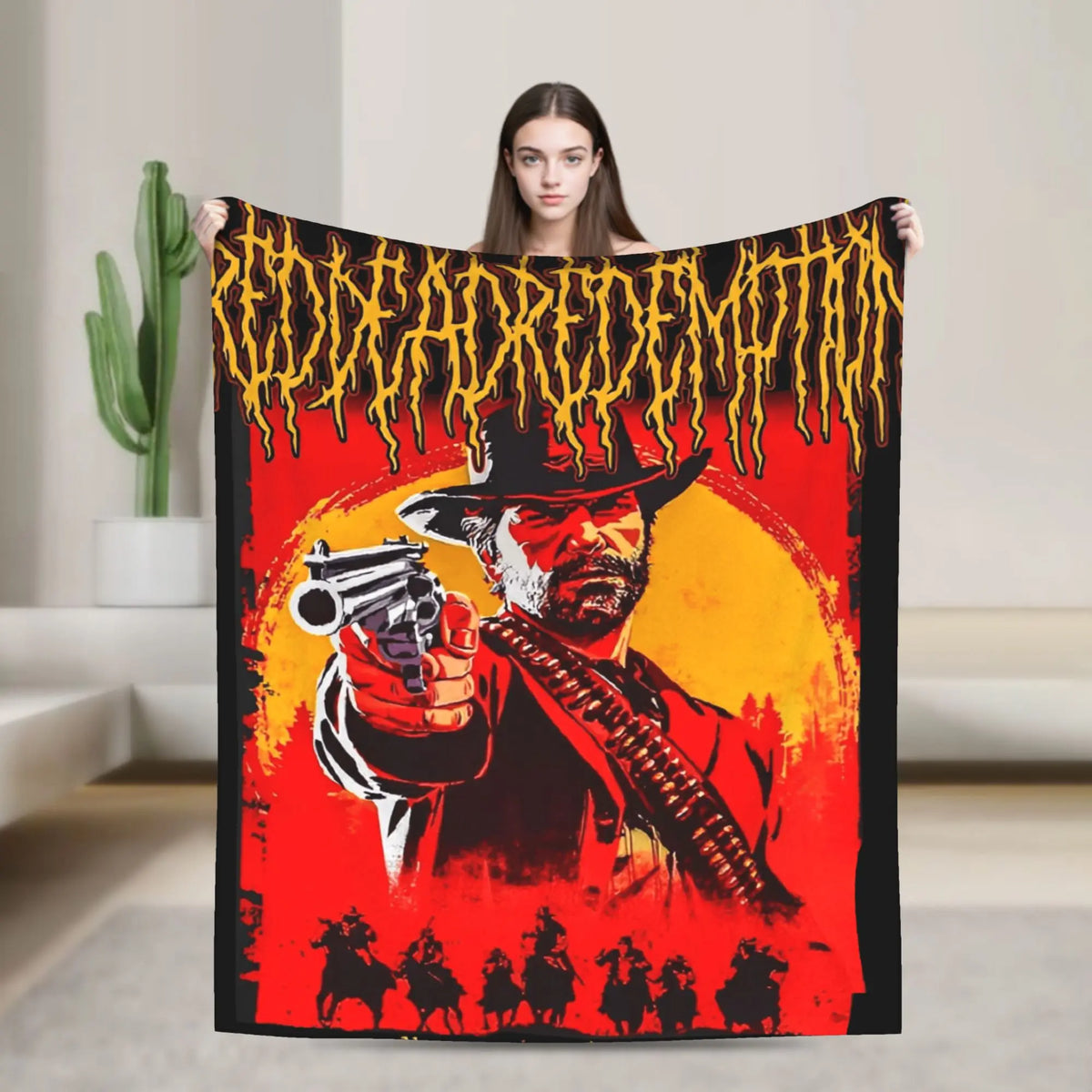A person holds up a black flannel throw blanket featuring a graphic of a cowboy gunfighter against a fiery background.