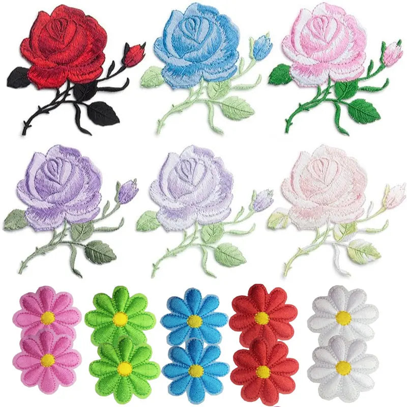 A set of embroidered iron-on patches featuring various shades of pink, purple, and blue roses.