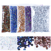 A collection of colorful resin rhinestone decorations in various shades including blue, gold, purple, and silver.