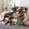 A fleece throw blanket featuring 3D printed images of Stray Kids members.