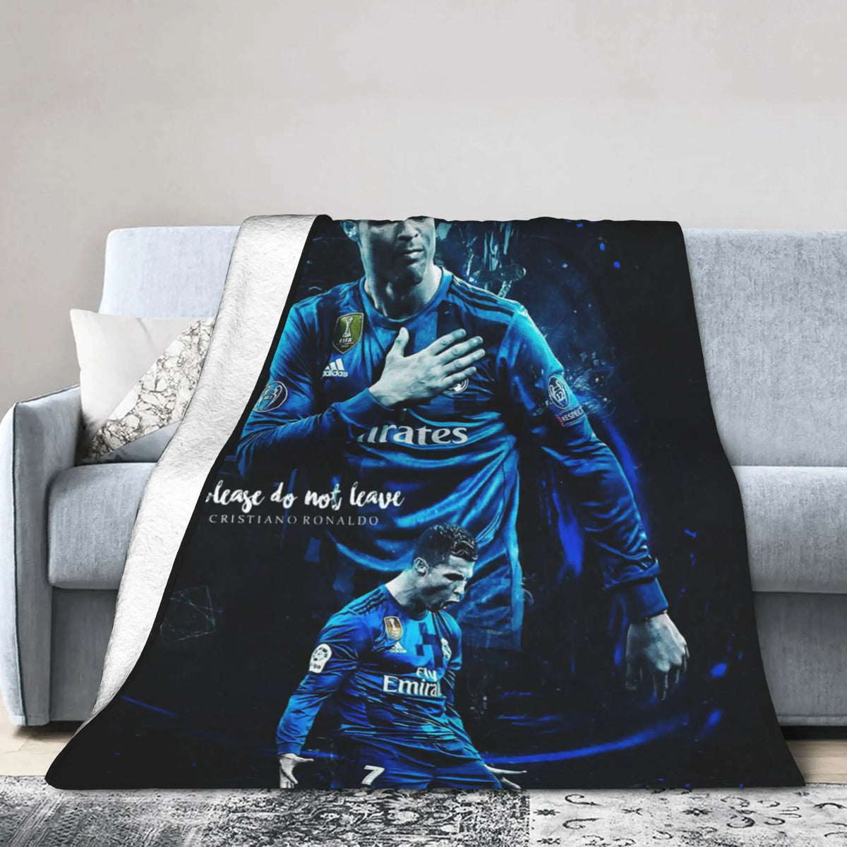 A dark blue football jersey print on a blanket featuring a player's portrait and the text 'Ease do not leave'.