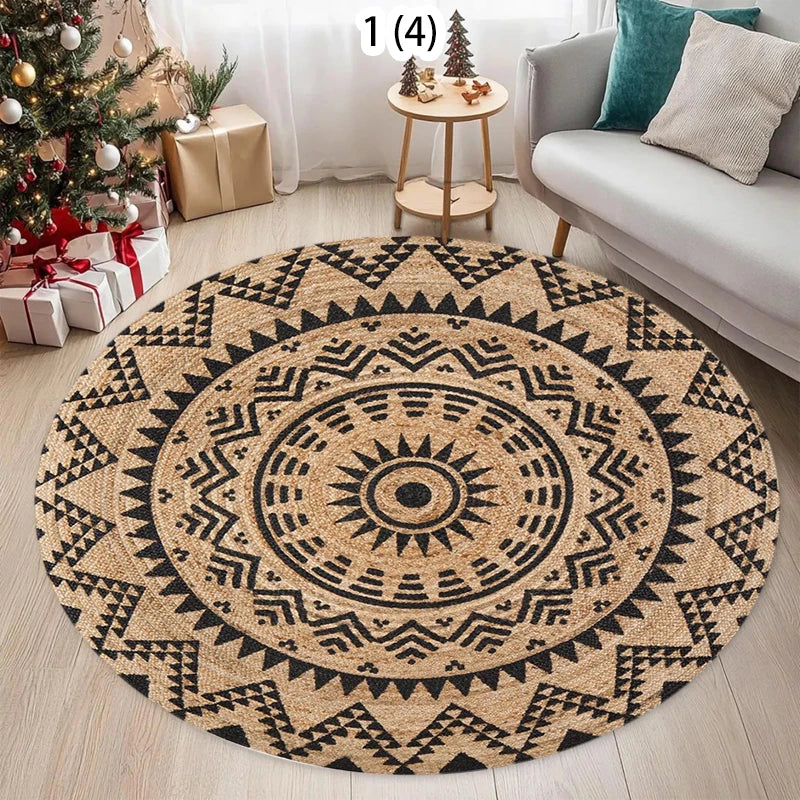 A round woven jute rug with geometric patterns in black and natural beige tones on a light wooden floor.