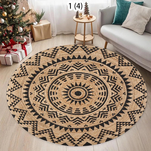 A round woven jute rug with geometric patterns in black and natural beige tones on a light wooden floor.