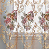 Sheer curtains featuring ornate gold floral embroidery and sheer fabric panels.