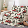 A vintage red truck Christmas throw blanket featuring numerous red pickup trucks and evergreen trees on a light background.