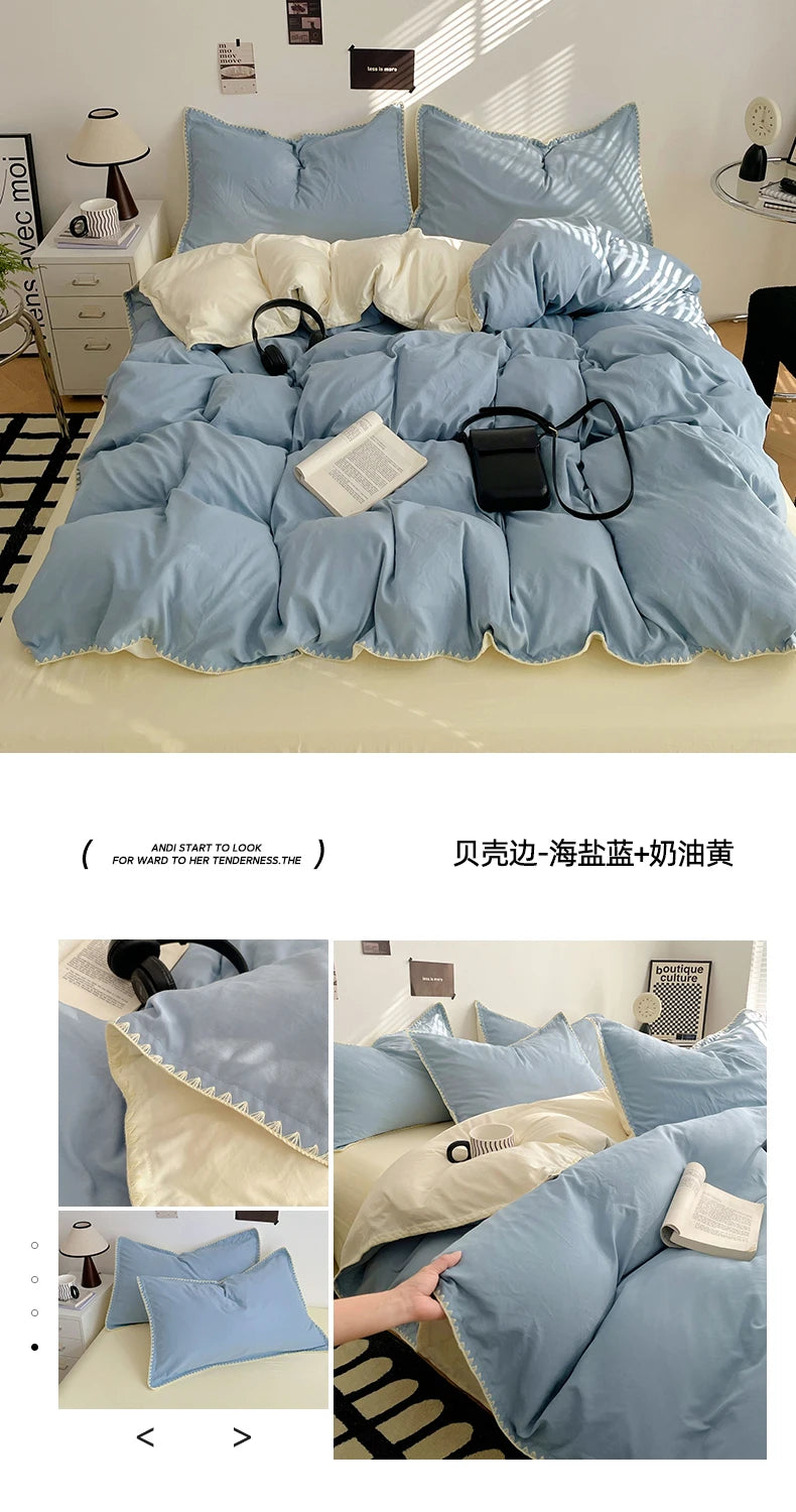 A set of light blue and cream quilted bed linen featuring pillows and a duvet cover.