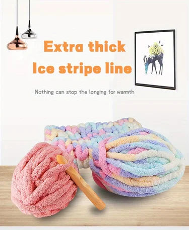 A pile of extra thick ice stripe line yarn in various pastel colors is shown next to a hanging light fixture.