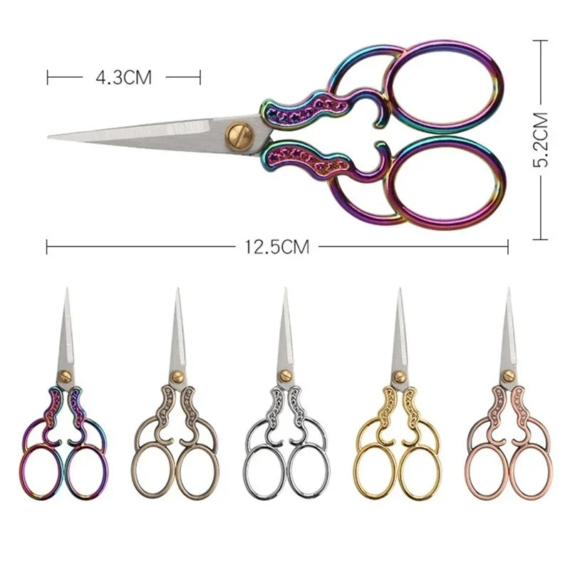 A pair of vintage stainless steel sewing scissors with purple and silver handles and blades.
