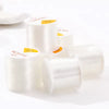 Rolls of transparent elastic cord for jewelry making labeled Crystal Tec