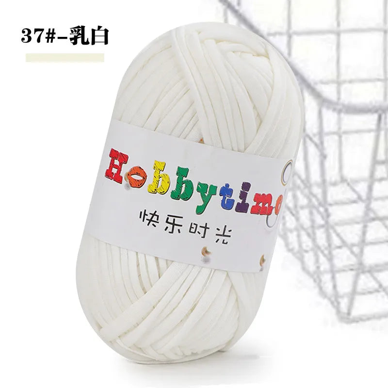 A ball of white thick polyester craft yarn labeled Hobbytime for knitting and crochet