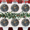 Six dark gray floral non-slip placemats with gold accents arranged on a white surface.