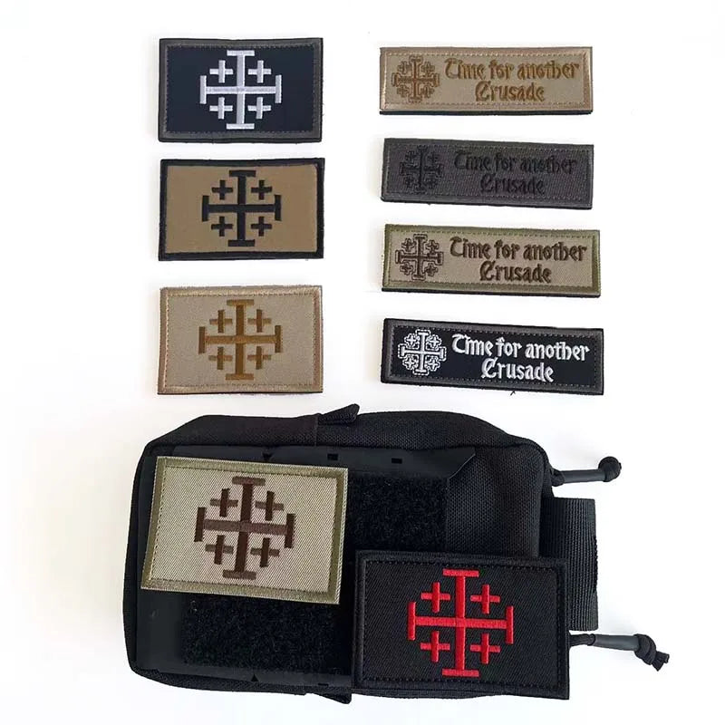 A set of tactical embroidered patches featuring a cross design and the text Time for another Crusade on various colored fabri