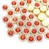 A cluster of sunflower crystal rhinestone sew-on buttons in shades of orange and gold.