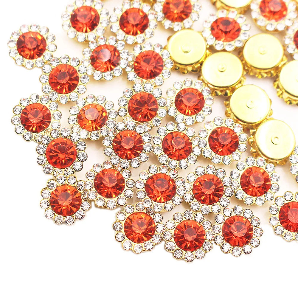 A cluster of sunflower crystal rhinestone sew-on buttons in shades of orange and gold.