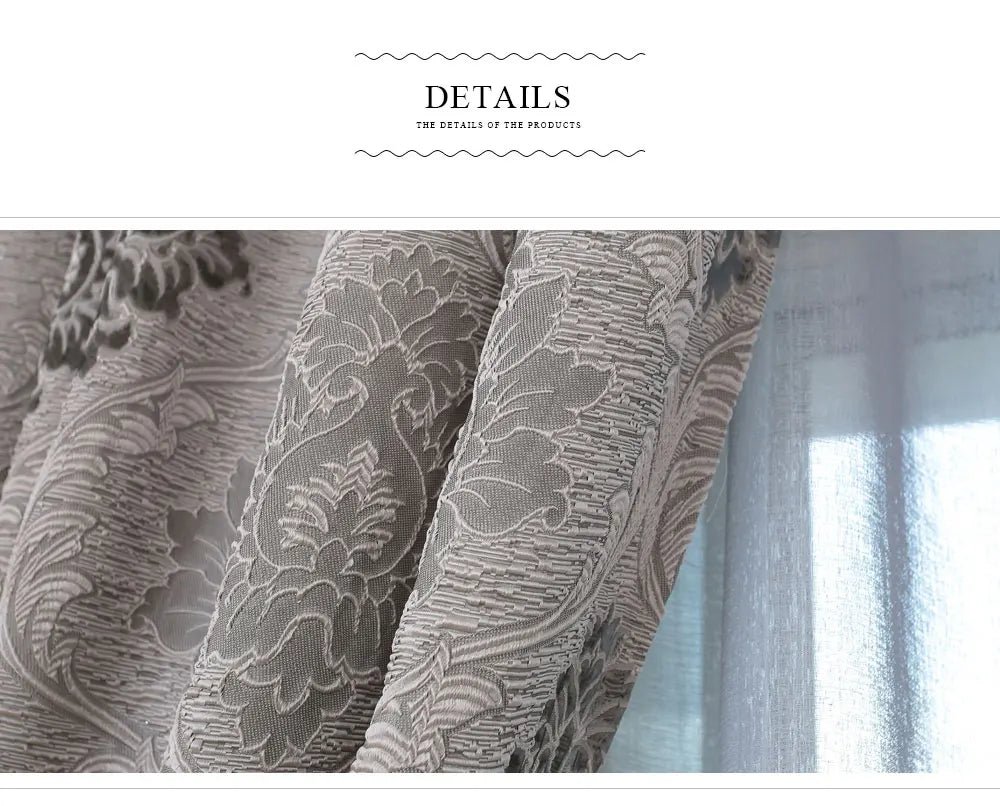 Close-up of gray European style sheer jacquard curtain panels with floral patterns hanging in a window.