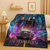 A dark blue and purple graphic blanket featuring characters from Supernatural and a vintage car.