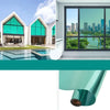 A close-up view of a teal insulated glass film rolled up, showing its smooth surface and thickness.