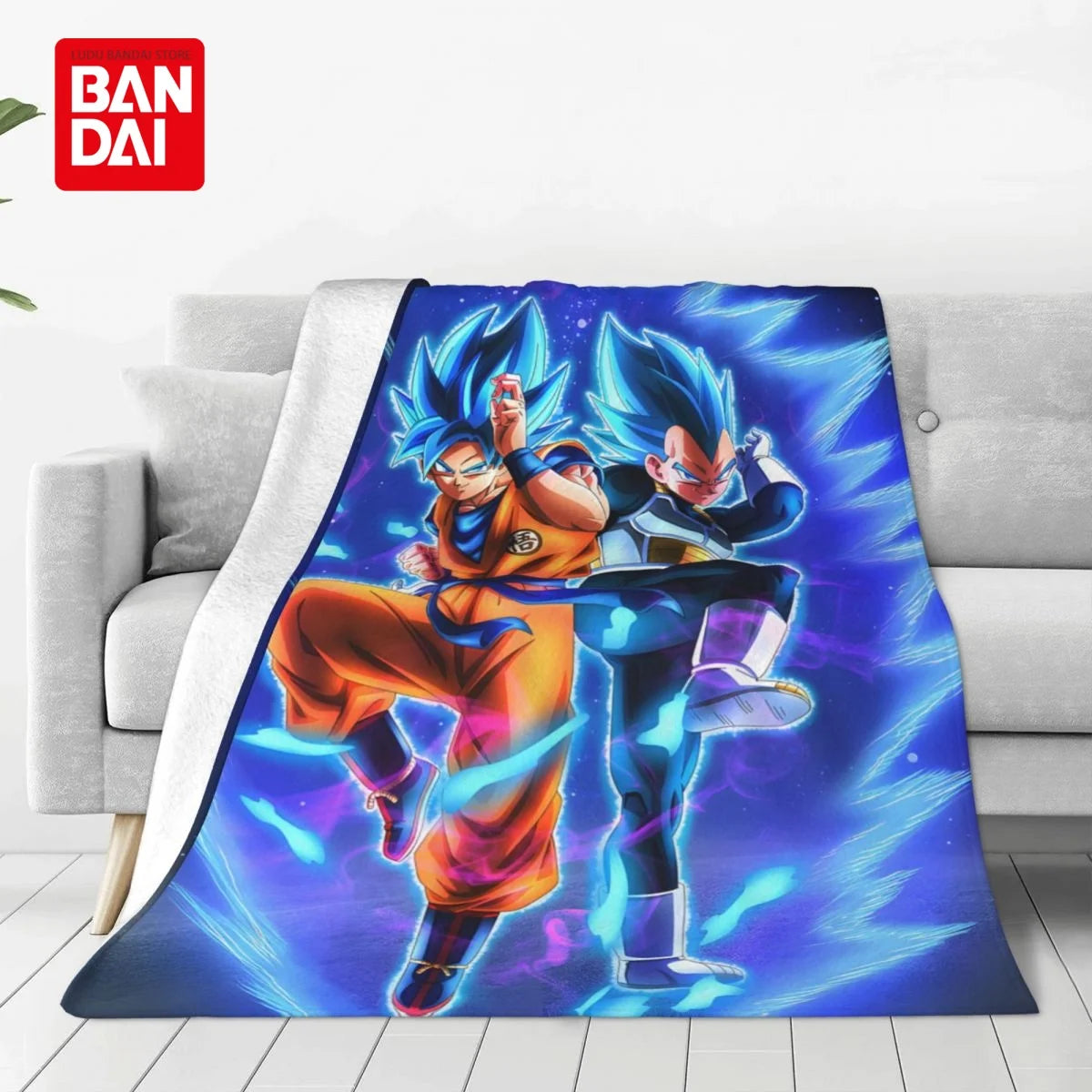 A blanket featuring two anime characters in blue and orange outfits against a vibrant purple background.