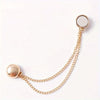 Gold chain necklace with a round pendant and a small hoop charm