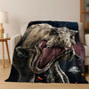 A realistic depiction of a roaring Tyrannosaurus Rex head printed on a dark fabric throw blanket.