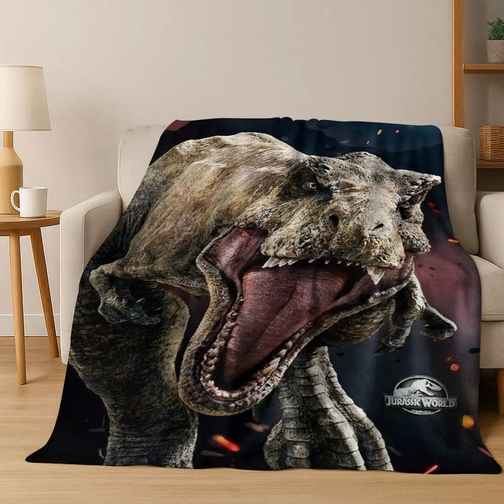 A realistic depiction of a roaring Tyrannosaurus Rex head printed on a dark fabric throw blanket.